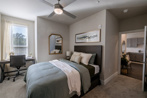 Furnished bedroom decorated with grey accent pieces