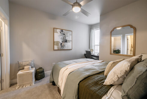 Furnished bedroom decorated with grey accent pieces