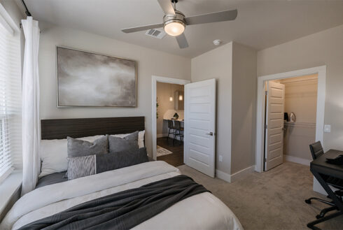 Furnished bedroom decorated with grey accent pieces