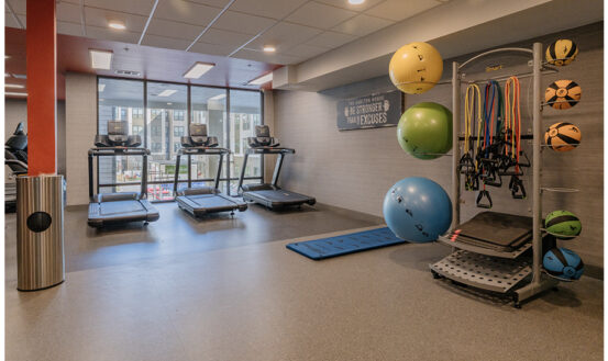 Fitness center with treadmills and yoga balls