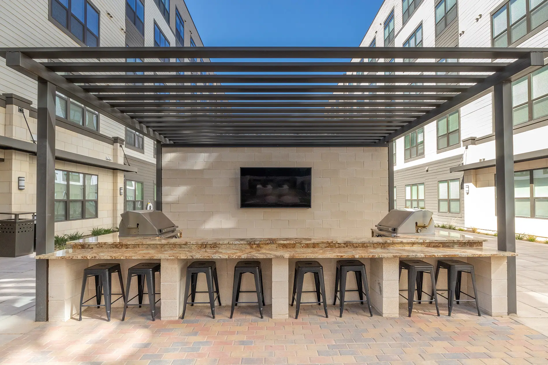 Outdoor kitchen with grilling stations