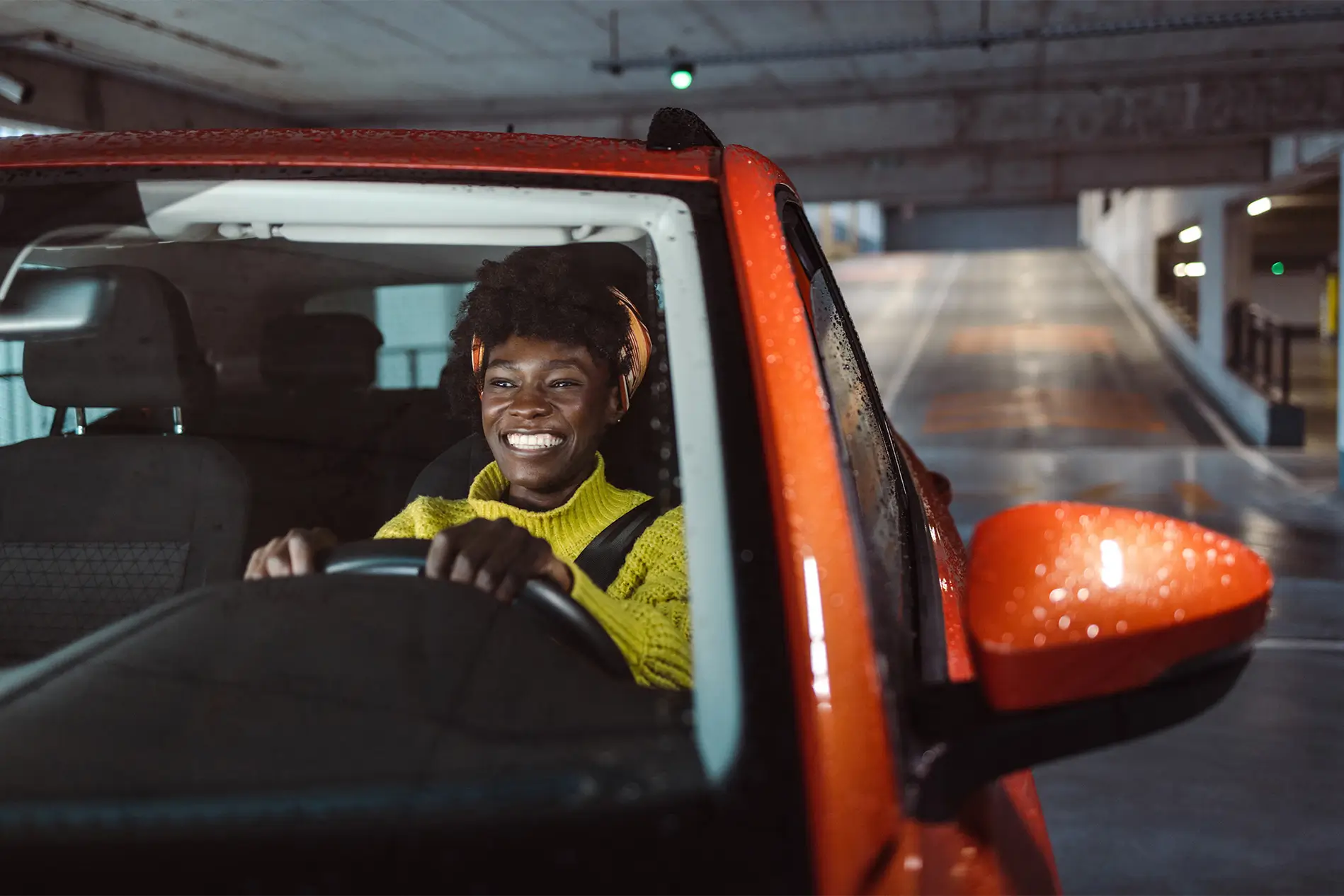 Young woman parking a car