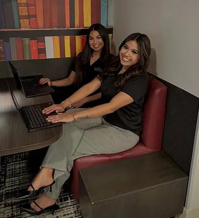 Two young women studying