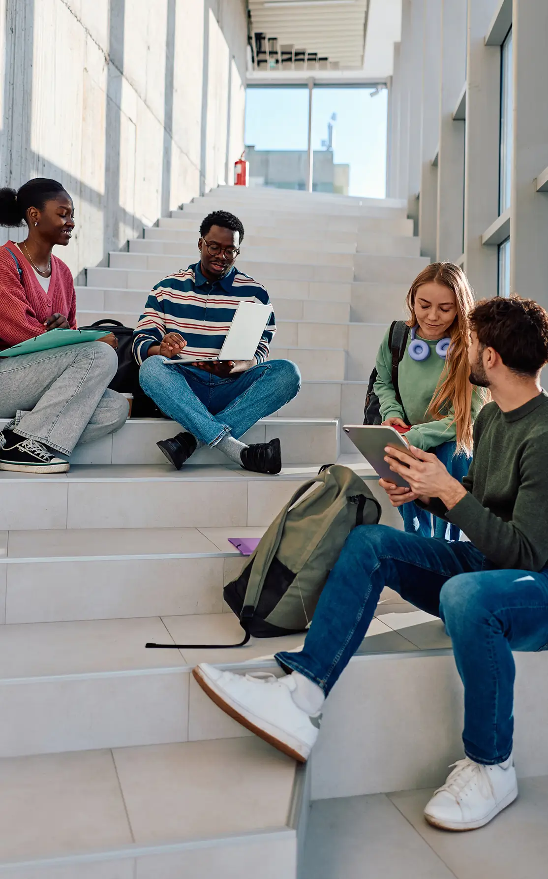 Students sitting on campus steps